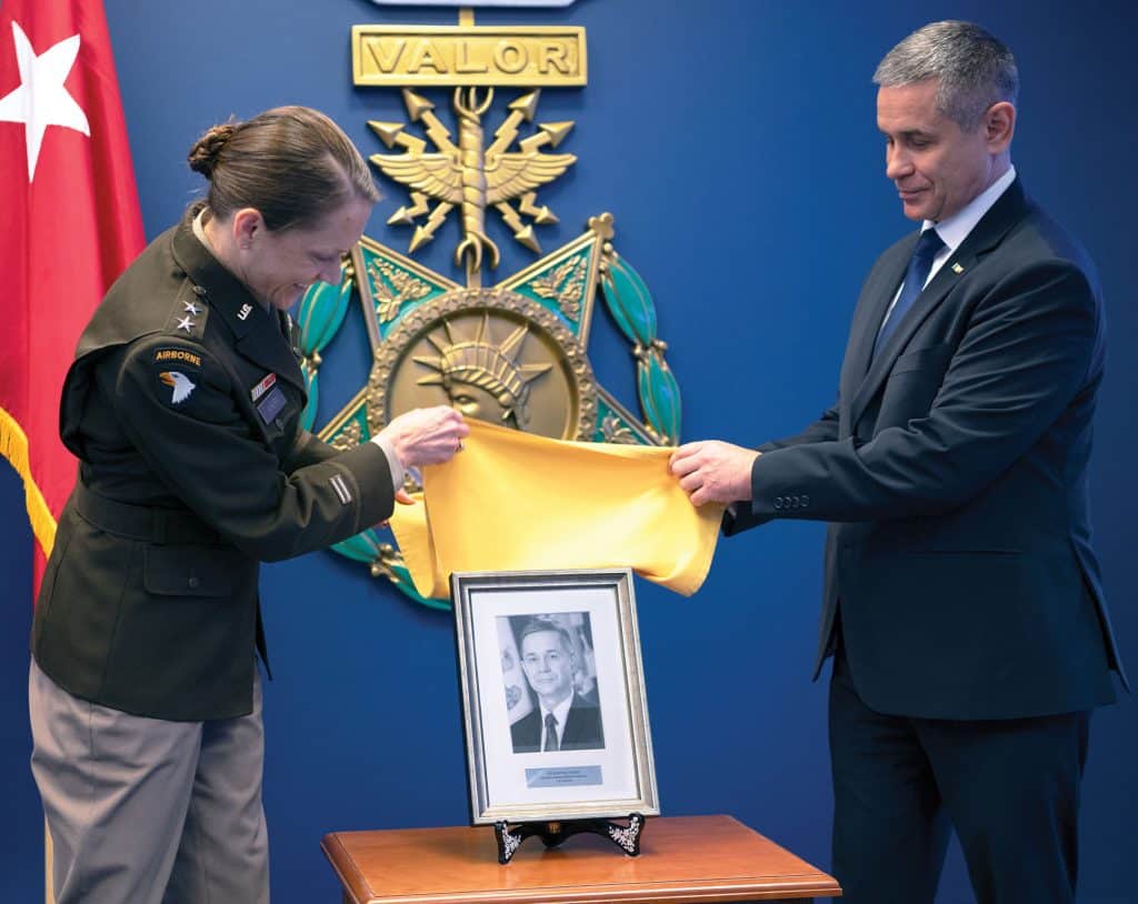 Maj. Gen. Stephanie Ahern, Director, Strategy, Plans and Policy, Office of the Deputy Chief of Staff, G-3/5/7, and Anatolie Nosatîi, Minister of Defence of the Republic of Moldova, unveil the portrait of Nosatîi that will be added to the Command and General Staff College’s International Hall of Fame gallery during his induction ceremony in the Pentagon Hall of Heroes, Arlington, Va. Aug. 20, 2025. (U.S. Army photo by Christopher Kaufmann)
