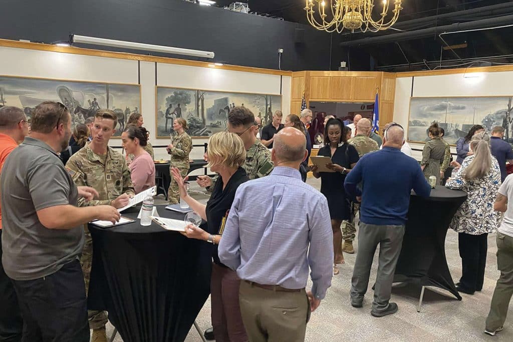 CGSOC students 'work the room' speaking with mentor prospects during the CGSC Mentor Program networking event Aug. 20, 2025 in the Frontier Army Museum.