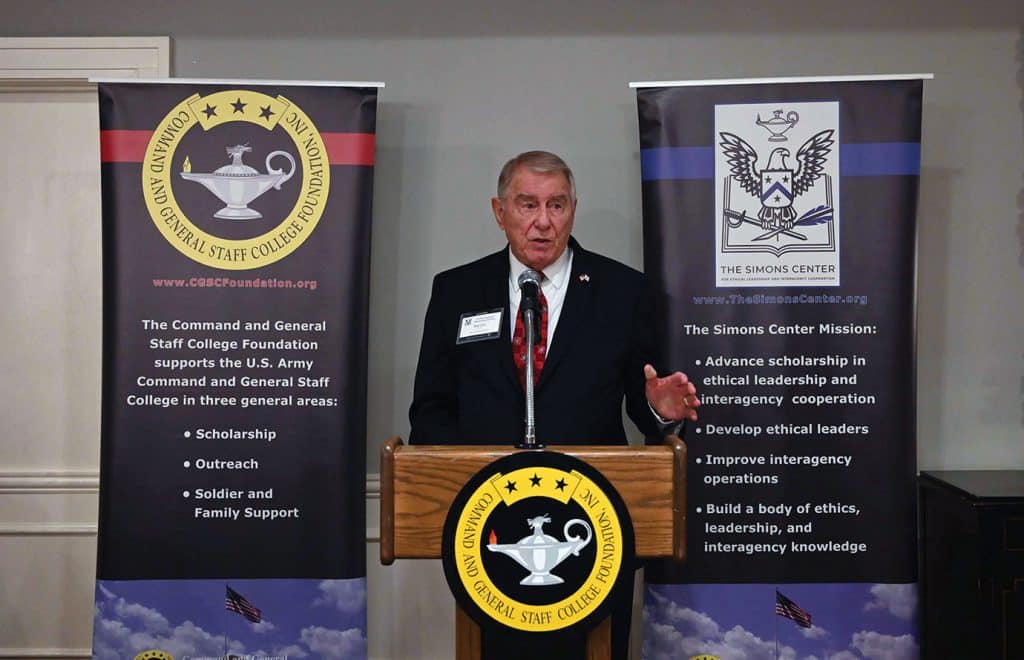 Col. (Ret.) Bob Ulin, founding CEO of the CGSC Foundation and its major program the Simons Center, provides farewell remarks at the Dec. 9, 2025, Holiday Social for the Arter-Rowland National Security Forum. Ulin established the Forum in 2005 and is now retiring, but will continue as an ARNSF member.