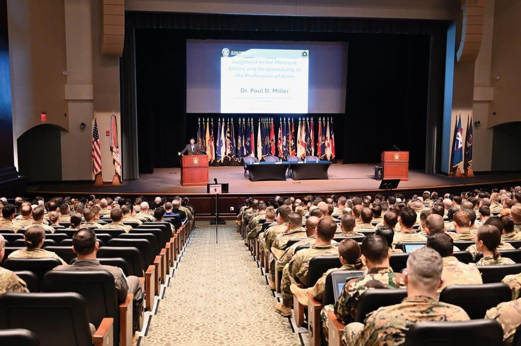 The CGSC Foundation's General Hugh Shelton Distinguished Visiting Chair of Ethics Paul David Miller, Ph.D., a professor at Georgetown University, delivers his keynote address, "Judgment in the Moment: Ethics and Responsibility in the Profession of Arms," during the 2026 CGSC Military Ethics Symposium on March 27, 2026, in the Lewis and Clark Center's Eisenhower Hall on Fort Leavenworth, Kansas.