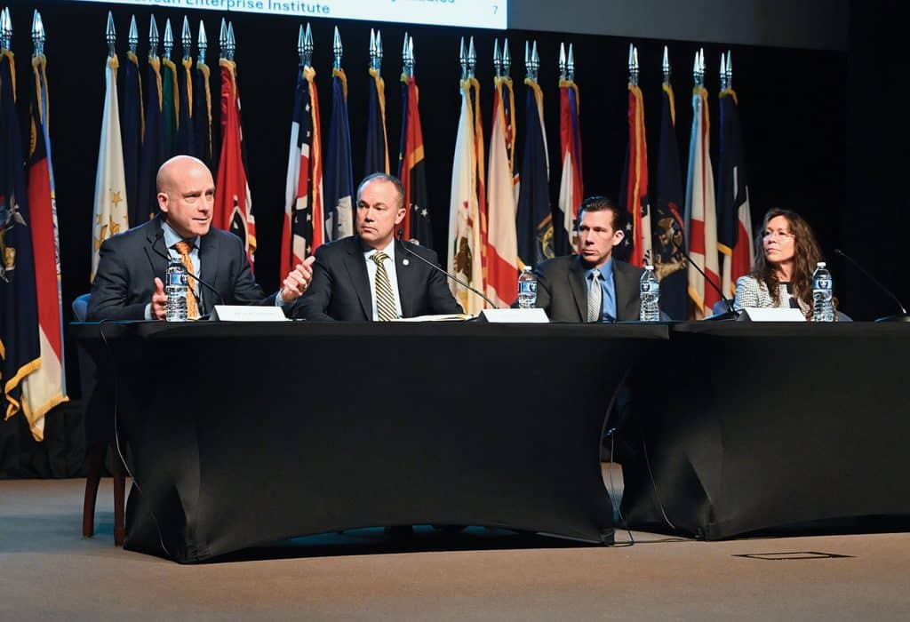 From left, Marc LiVecche, Ph.D., the McDonald Distinguished Scholar of Ethics, War, and Public Life at Providence, non-resident research fellow at the U.S. Naval War College, and adjunct professor of ethics at the U.S. Naval Academy; Eric Patterson, Ph.D., president/CEO of the Victims of Communism Memorial Foundation; the CGSC Foundation's General Hugh Shelton Distinguished Visiting Chair of Ethics Paul David Miller, Ph.D.,; and Kori Schake, Ph.D., a senior fellow and the director of foreign and defense policy studies at the American Enterprise Institute, lead a discussion panel during the CGSC Military Ethics Symposium, March 27, 2026, in the Lewis and Clark Center's Eisenhower Hall on Fort Leavenworth, Kansas.