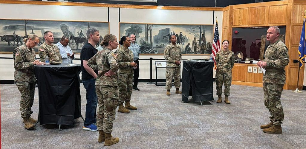 CGSC Commandant Col. Ethan Diven addresses mentees and mentors at the AY26 closing social at the Frontier Army Museum on April 23, 2026.