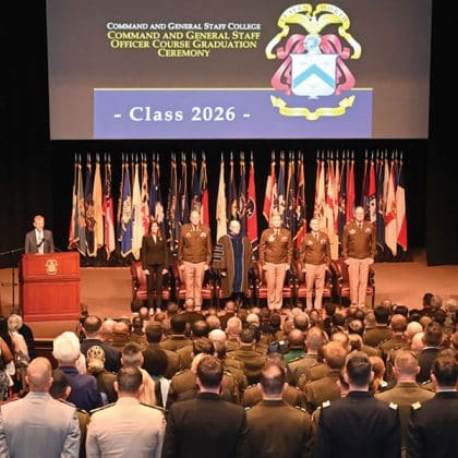 wide angle of the stage at the graduation ceremony for the CGSOC Class of 2026 on May 29, 2026, in the Eisenhower Auditorium of the Lewis and Clark Center on Fort Leavenworth, Kansas.