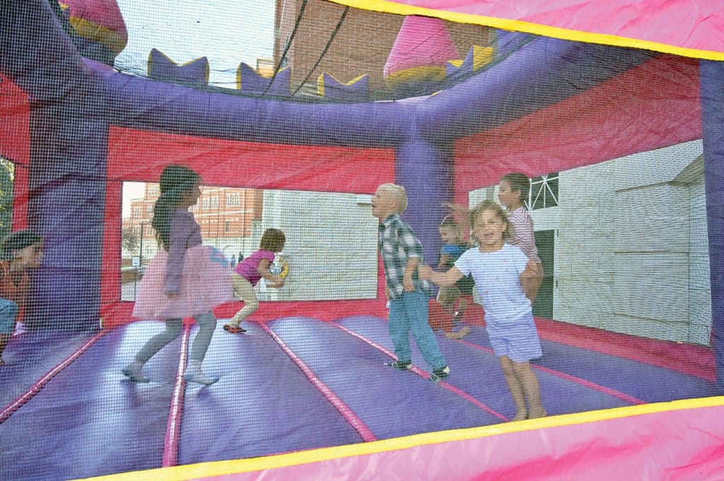 CGSC kids filled two bouncy houses non-stop during the CGSC Organization Day hosted by the CGSC Foundation and Alumni Association on the Lewis and Clark Center patio Oct. 2, 2026.