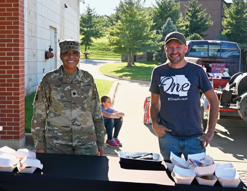 CGSC Organization Day sponsor Cory Trowbridge of Arvest Bank, right, and Lt. Col. Sherita Young take a break from grilling and serving hot dogs during the CGSC Organization Day hosted by the CGSC Foundation and Alumni Association Oct. 2, 2026.